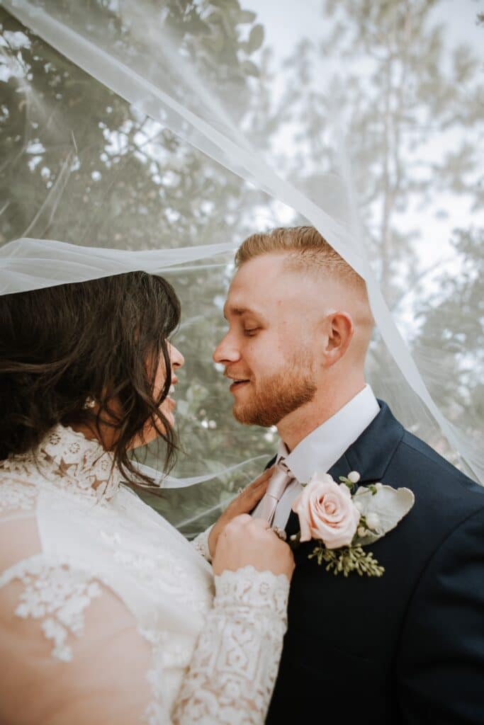 bride and groom portrait under veil