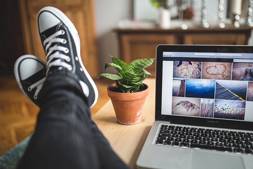 person working on computer online photo gallery