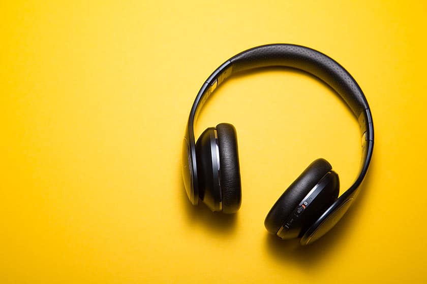 headphone on yellow surface