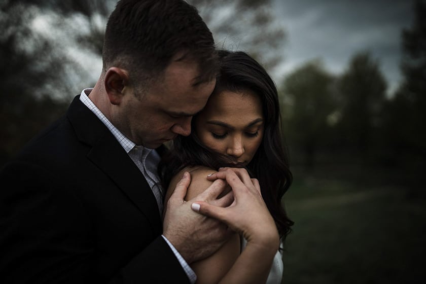 wedding portrait by Josue Prince of a groom holding a bride while standing behind