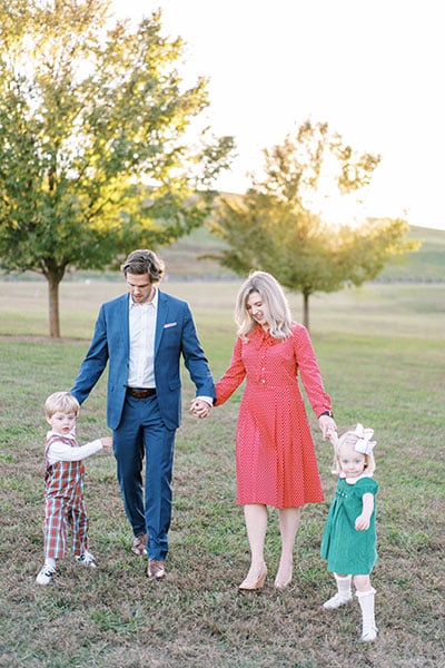 family holding hands while walking