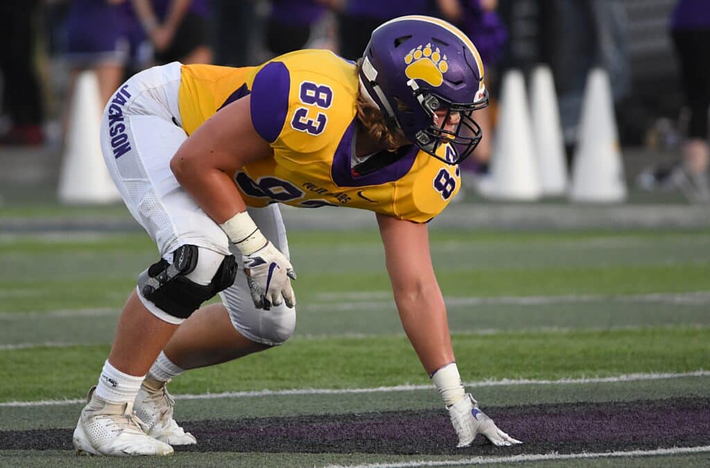 football player in three point stance