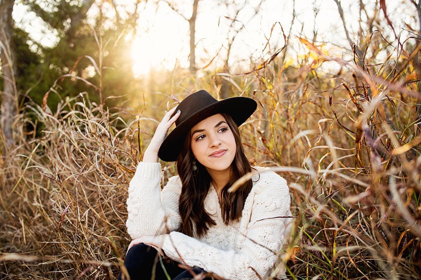 teenage girl wearing black hat