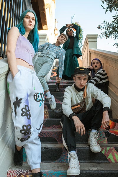 Group of five people gathered on steps