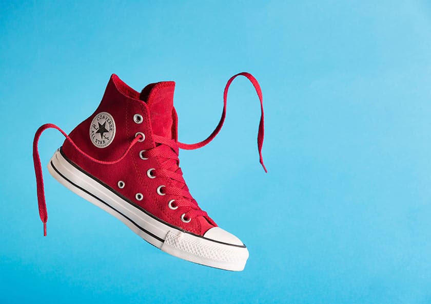 red hightop sneaker floating