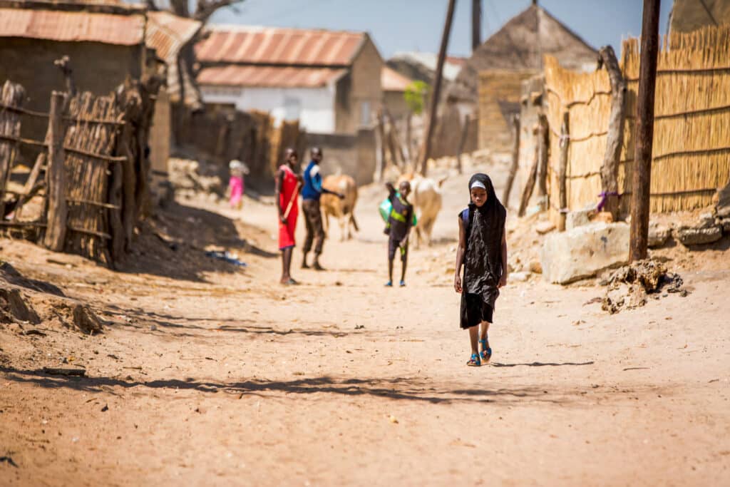 Laura Grier girl walking to school