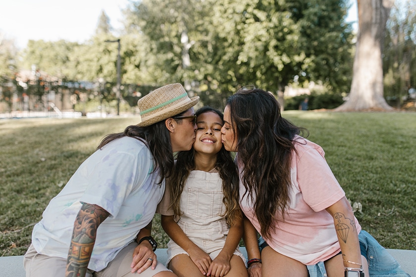 lgtbqia family portrait daughter with moms