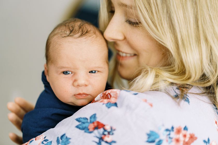 mother holding newborn baby