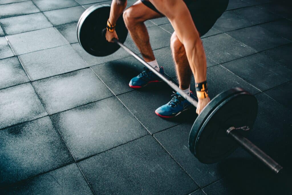 person holding large barbell