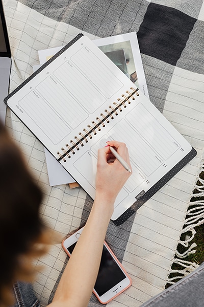 person working on a planner