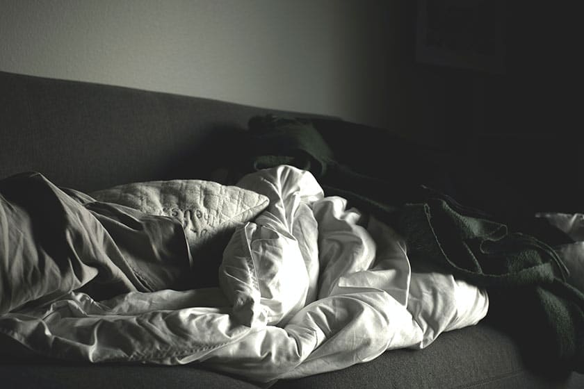 black and white image of blankets on couch still life