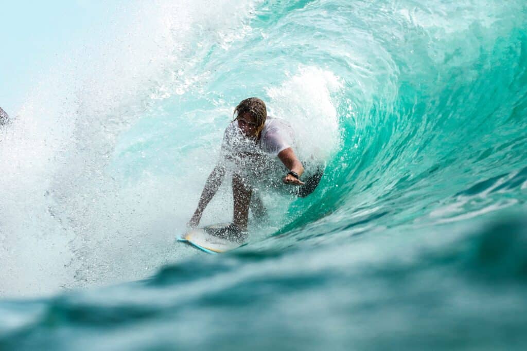 surfer from inside a curling wave