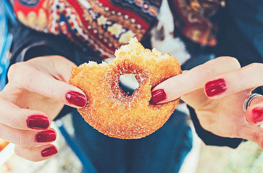 woman eating a donut