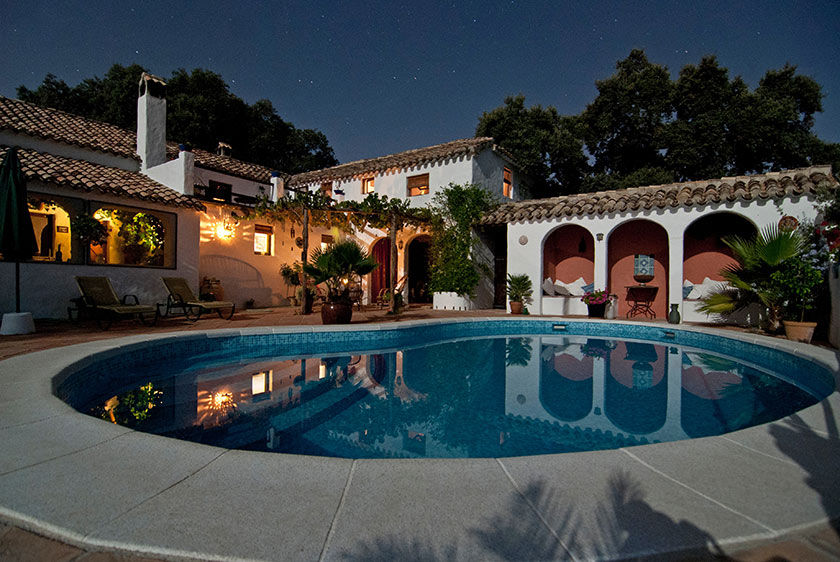 night time backyard pool