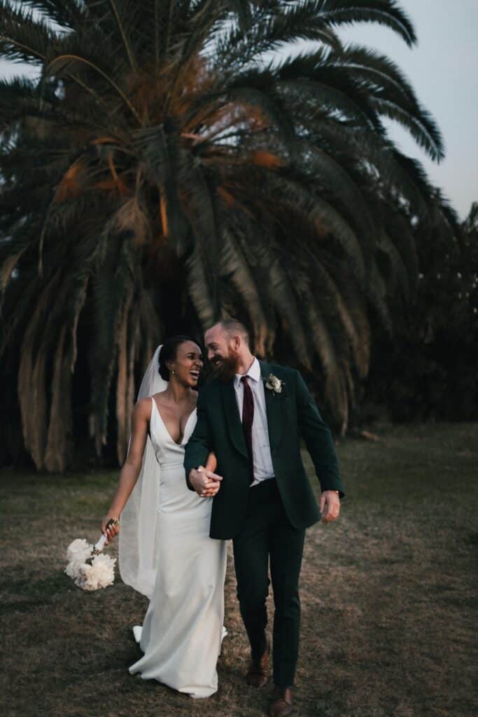 wedding couple portrait walking and laughing