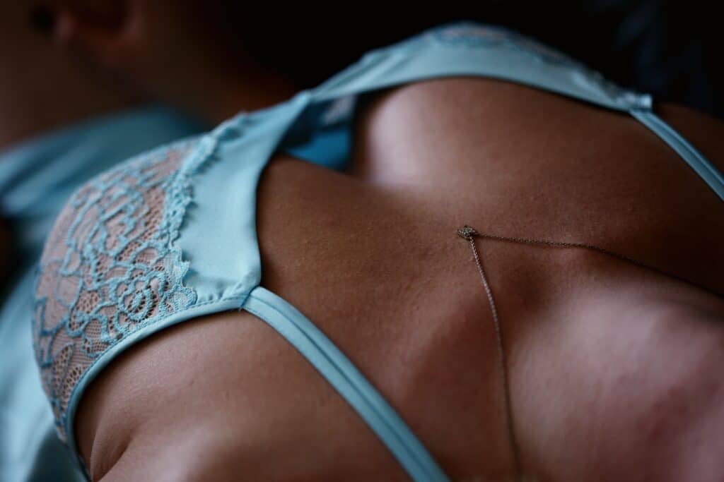 A sensual and lovely image of a twenty-four year old woman wearing silky baby blue lacy lingerie.