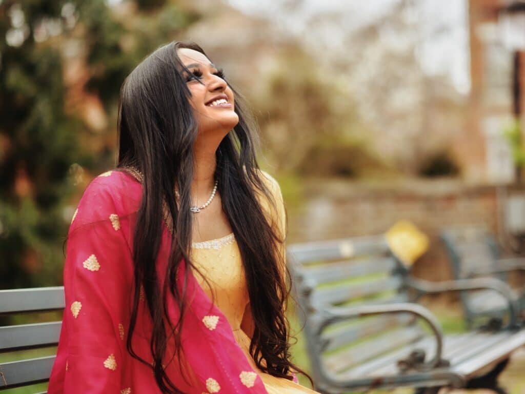 young woman wearing yellow dress and red scarf