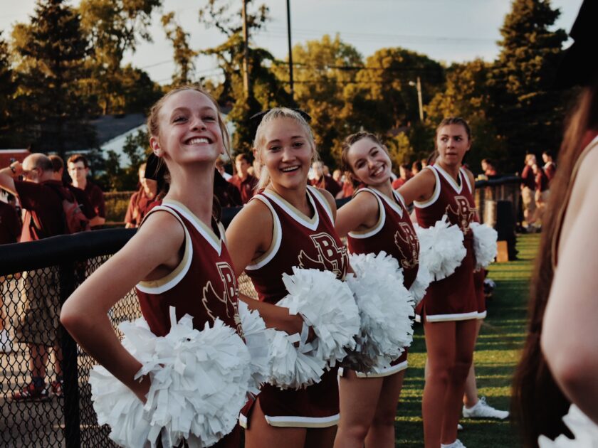 youth cheerleaders on sidelines